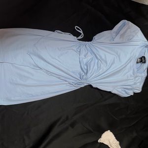 Light blue dress never worn, two holes in the side (how the dress was made) .